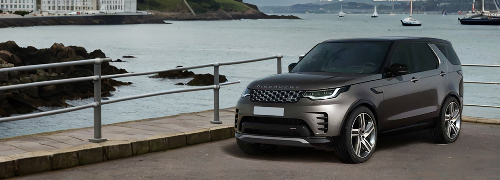 A Compact Land Rover Discovery SUV by the port in a city